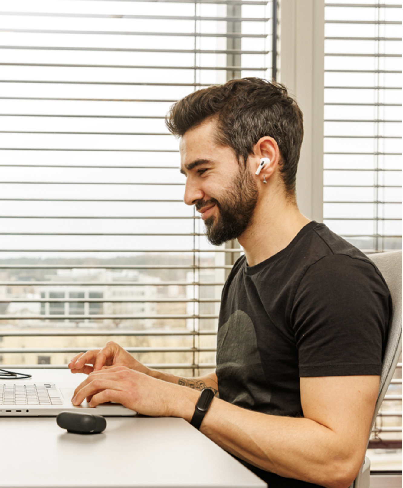 Roman Dosyn working at his desk in Helsinki